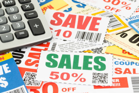 Saving discount coupon voucher with calculator, coupons are mock-up